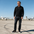 Man wearing Sullivan Court Sneakers in black on an airfield apron