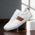 Sullivan Court Sneakers in white with cognac stripe, side view on a wooden floor
